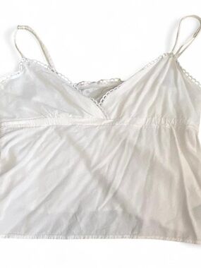 White lace trim baby doll cami top with adjustable straps. Size Small